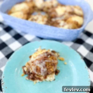 Delicious and easy Cinnabon cake, swirled with cinnamon sugar and topped with cream cheese frosting.