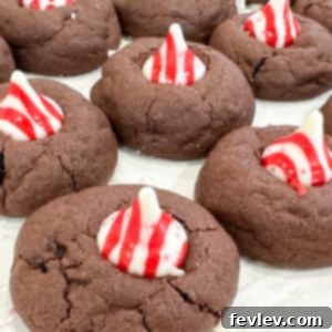 Festive Candy Cane Kiss Cookies with chocolate and mint