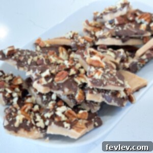 Delicious homemade English Toffee with melted chocolate and chopped almonds, broken into delectable pieces.