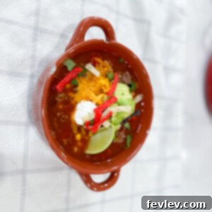 Delicious One Pot Taco Soup in a bowl, garnished with fresh toppings