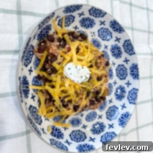 Delicious and colorful Slow Cooker Burrito Bowl with fresh toppings