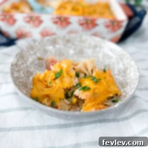 Delicious Barbecue Ranch Chicken Casserole, garnished with fresh green onions and melted cheese