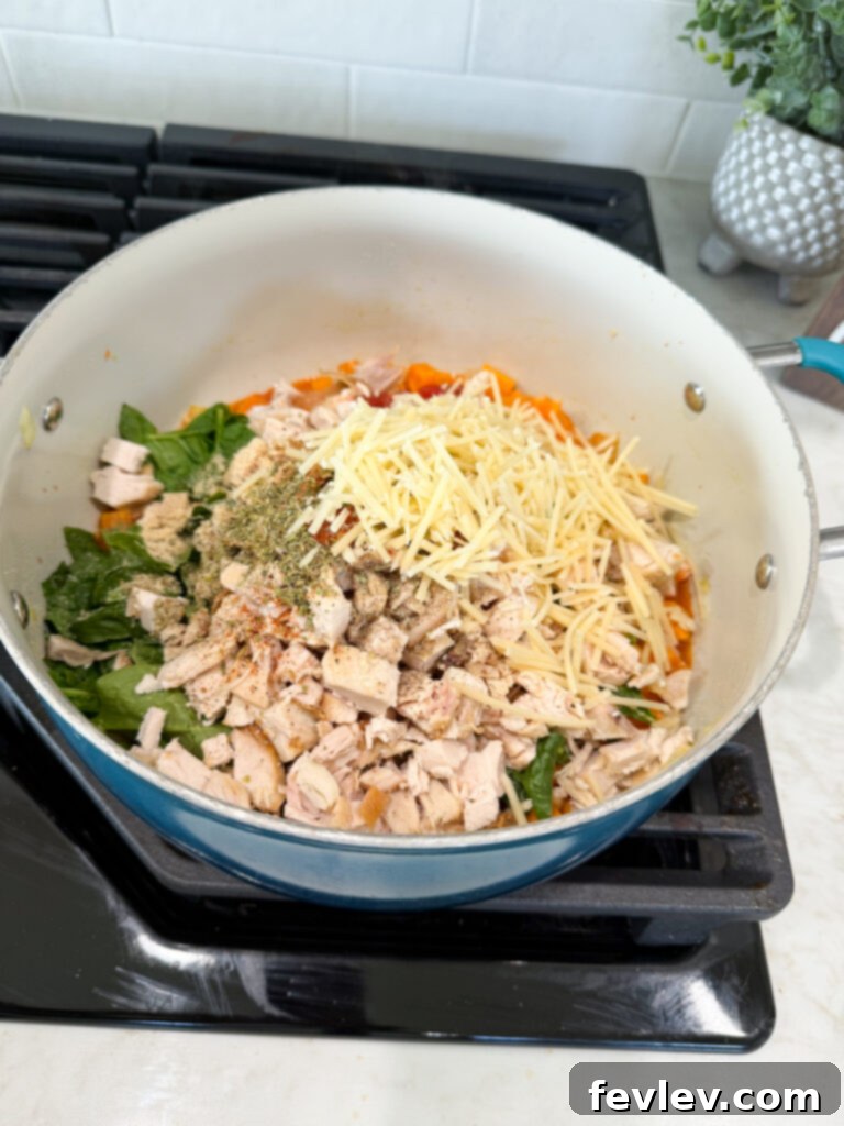 All ingredients combined in the pan for the chicken and sweet potato dinner
