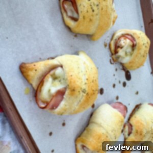 Close-up of golden Chicken Cordon Bleu Pockets, showcasing their flaky crust and melted cheese, perfect for an easy family meal.