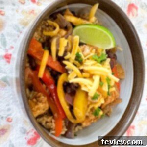 Delicious chicken fajita bowl with seasoned taco rice and fresh toppings