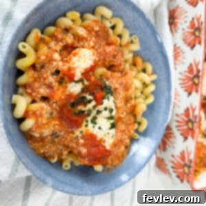 Delicious Ricotta Chicken Bake topped with fresh basil, ready to serve as a comforting Italian dinner.