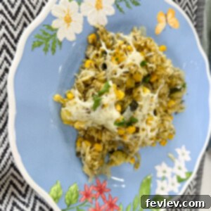 Delicious and creamy Pesto Orzo Casserole baked to perfection, garnished with fresh basil.