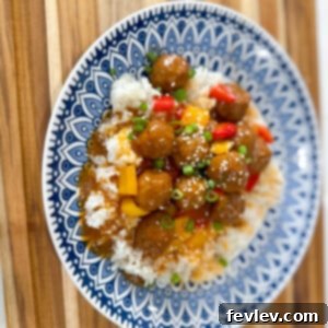 Delicious Sweet and Sour Meatballs in a vibrant sauce with bell peppers