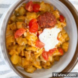 Hearty Enchilada Potato Skillet, a one-pan Tex-Mex dish with seasoned potatoes, chicken, and melted cheese