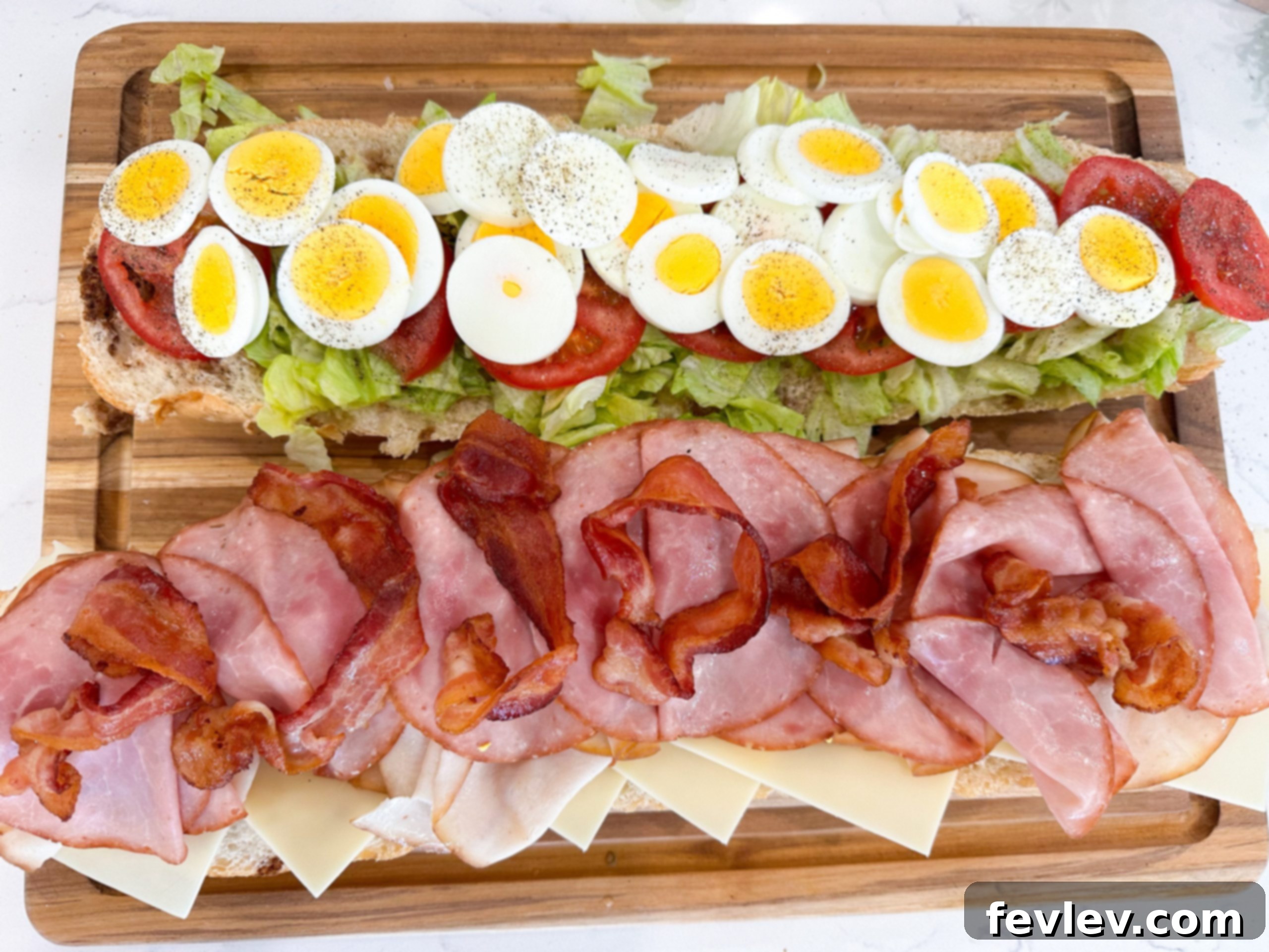 Italian Cobb Sub 5 Italian bread being brushed with dressing