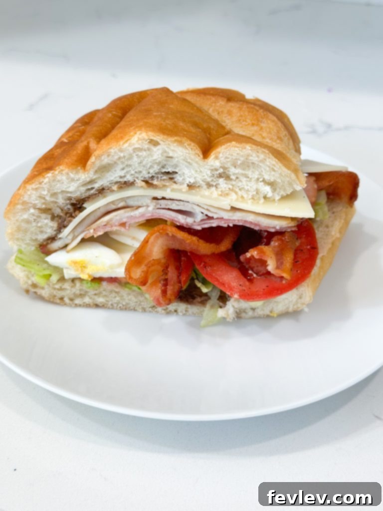Italian Cobb Sub 7 Italian cobb salad sub with a serving knife