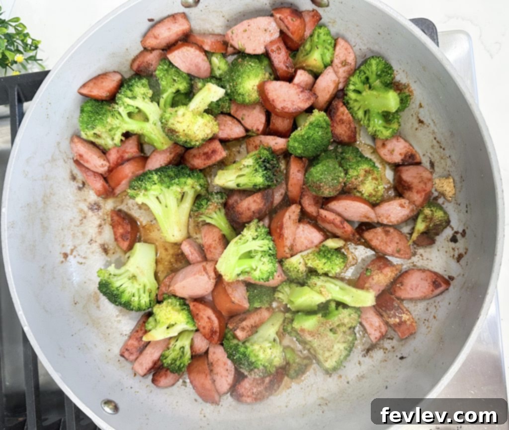 Smoked Sausage Mac and Cheese: A Five Dollar Feast 5 Sausage and broccoli simmering in a skillet
