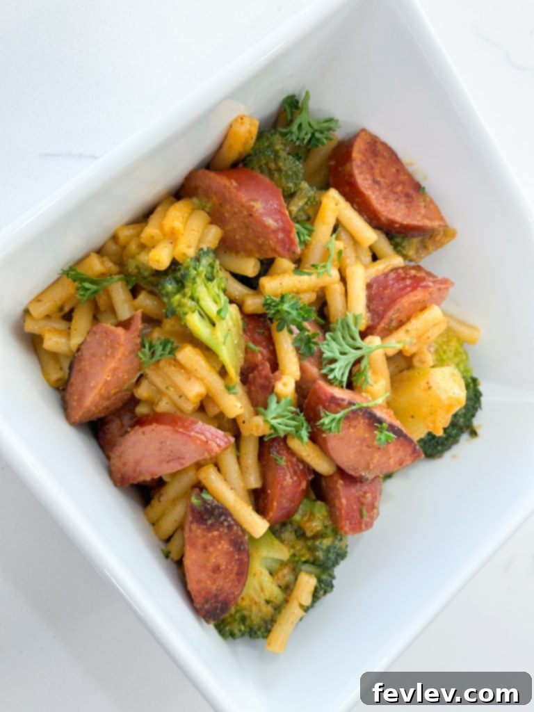 Smoked Sausage Mac and Cheese: A Five Dollar Feast 9 Smoked sausage mac and cheese served in a bowl