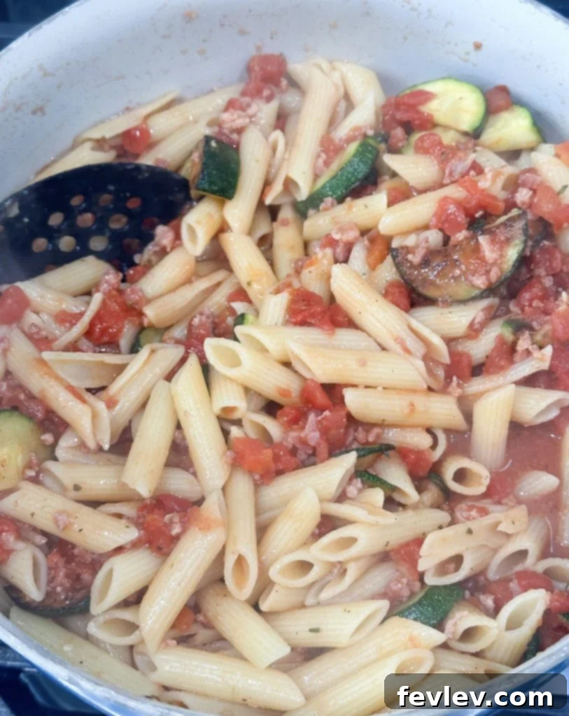 Bacon Tomato Pasta on a Budget 8 Leftover Tomato Bacon Pasta stored in an airtight container for meal prep.