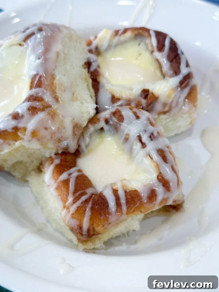 A collection of ingredients for making cream cheese danishes, including Kings Hawaiian rolls, butter, sugar, cream cheese, and eggs.