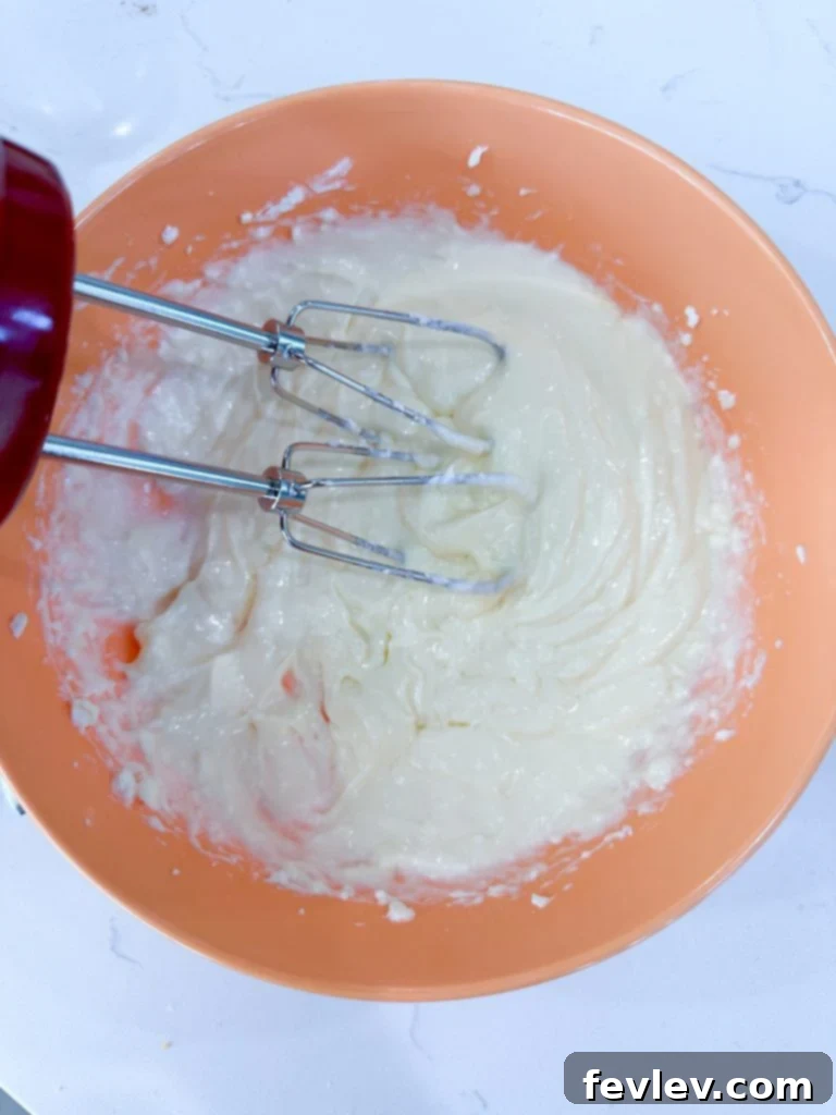 Bowl of smooth cream cheese filling, ready to be spooned into danishes.