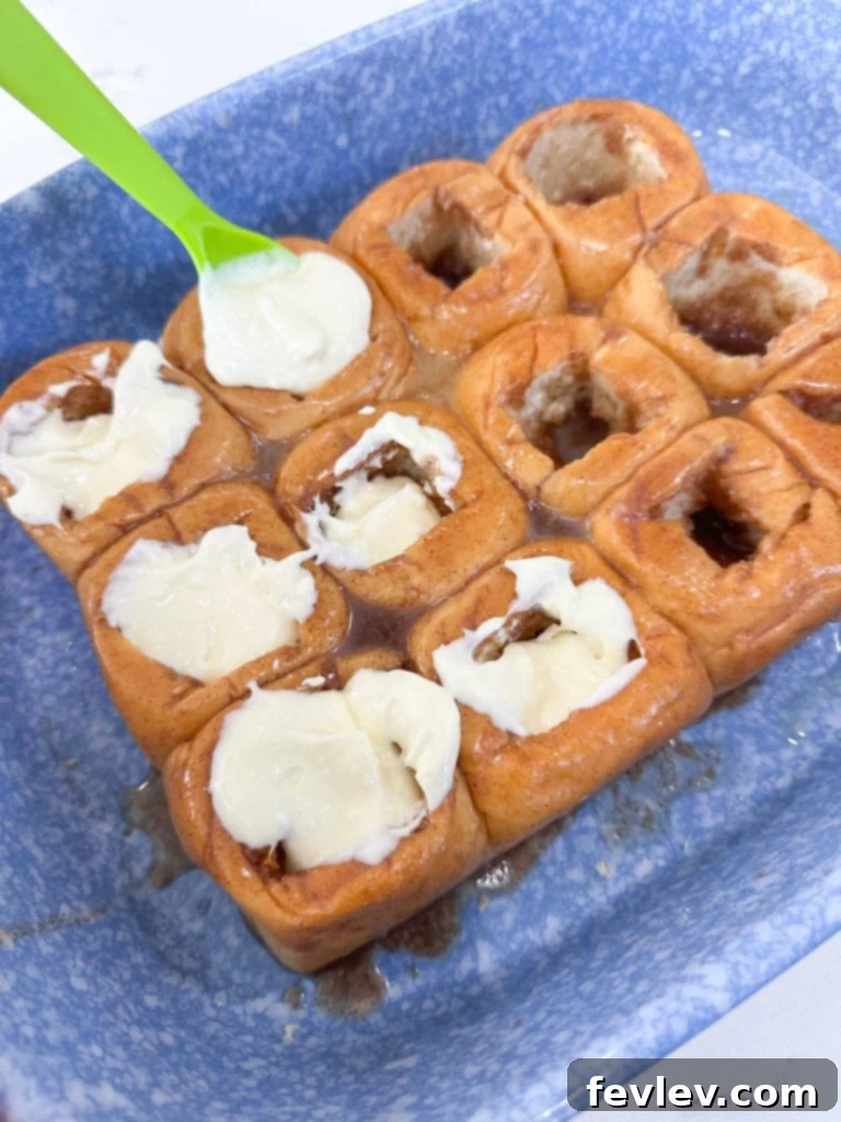 Hawaiian rolls filled with the creamy cream cheese mixture, ready for baking.