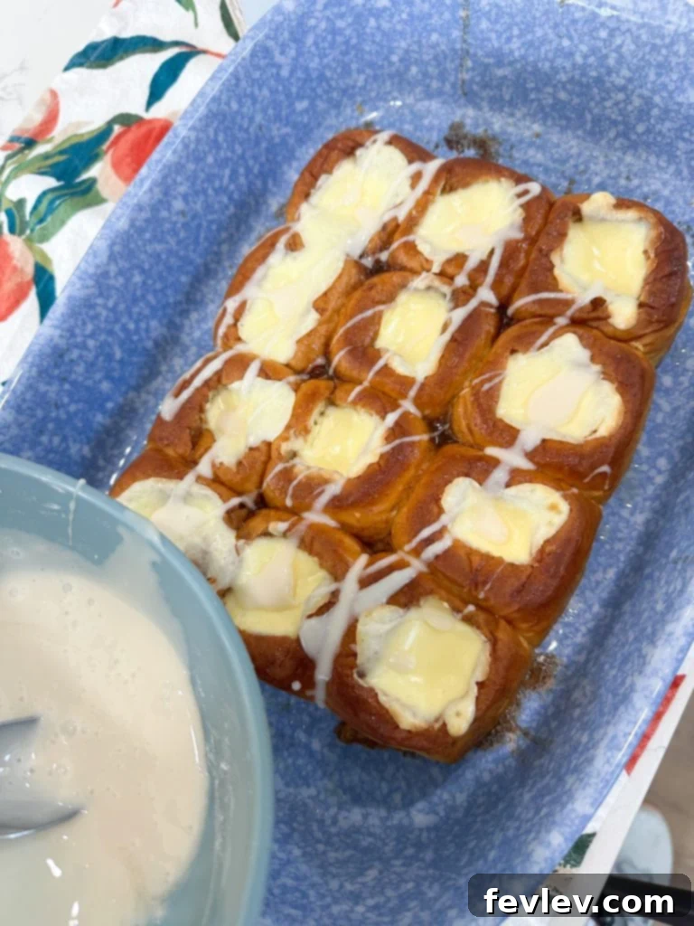 Finished cream cheese danishes drizzled with vanilla glaze, ready to be served.