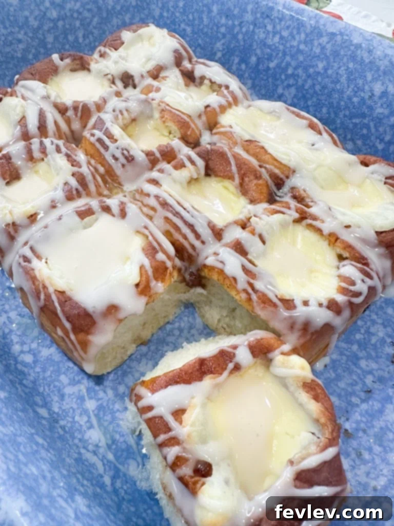 Close-up of a perfectly baked cream cheese danish with glaze.