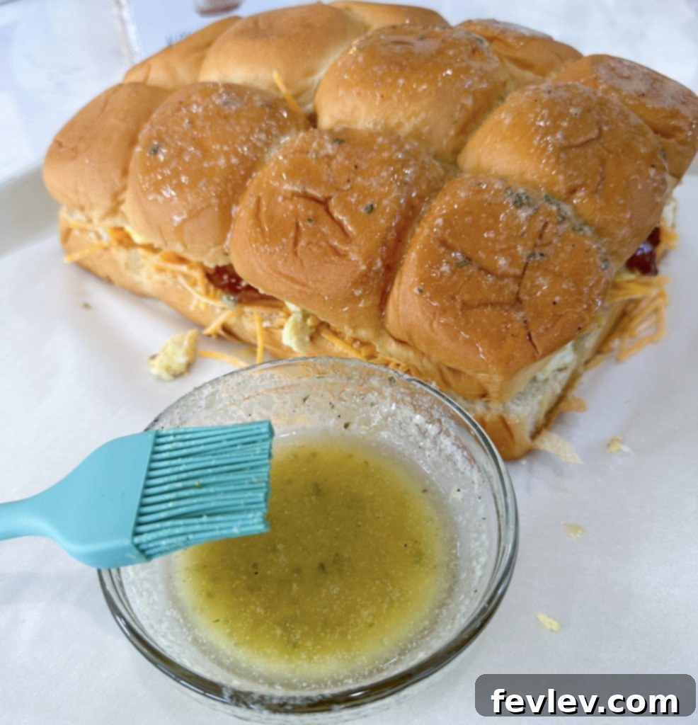 Grab-and-Go Breakfast Bites 7 Baked breakfast sliders with melted cheese and crispy bacon