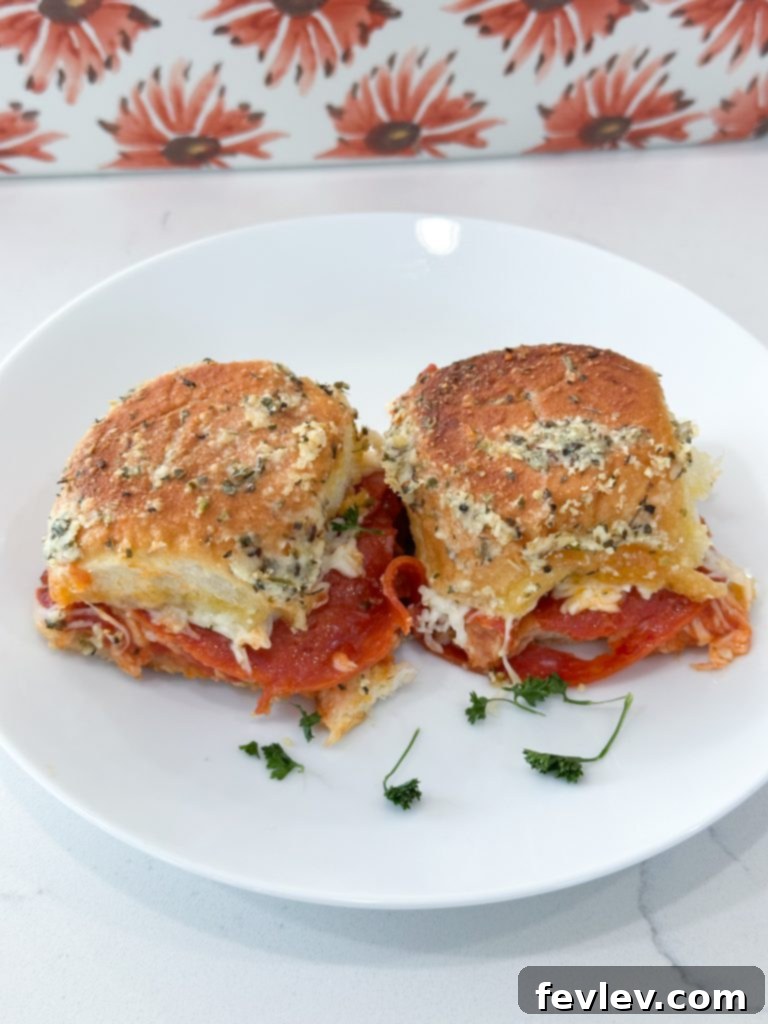 Mini Pizza Melts 6 A selection of various customizable pizza sliders with different toppings, demonstrating creative options for Hawaiian rolls.