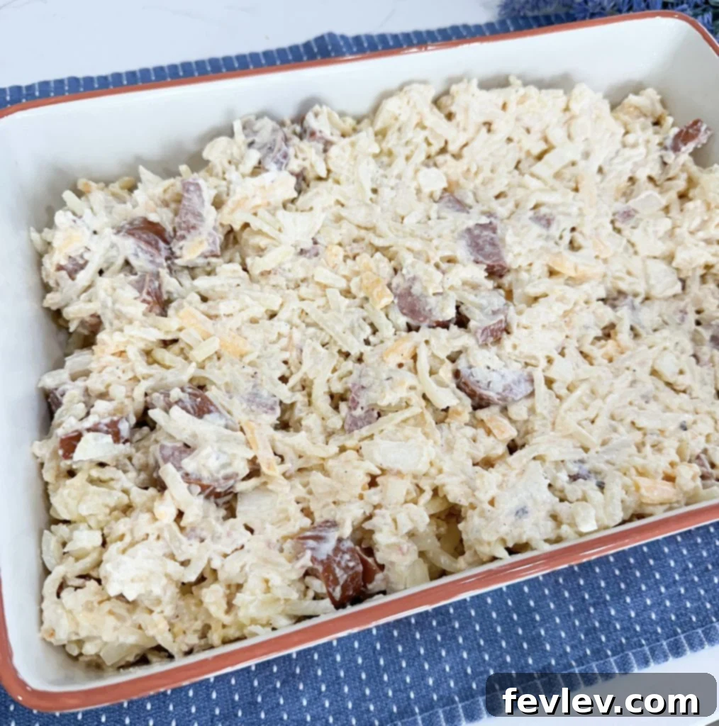 Mixed ingredients for Dump and Go Sausage Hashbrown Casserole
