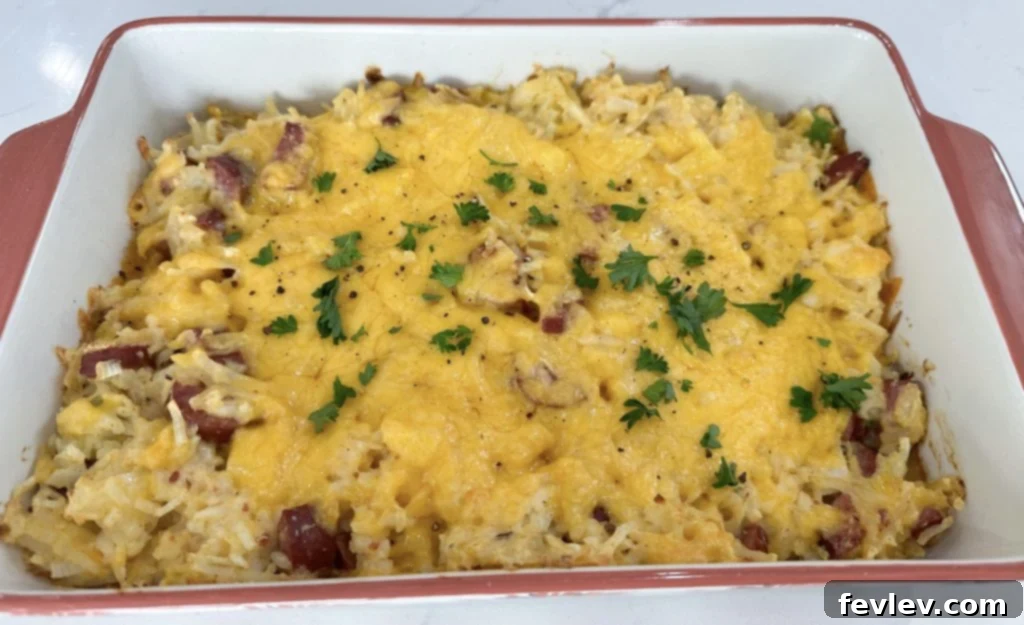 Dump and Go Sausage Hashbrown Casserole baking in a dish