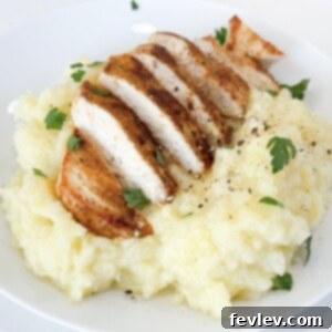 Perfectly golden-brown pan seared chicken breast in a skillet