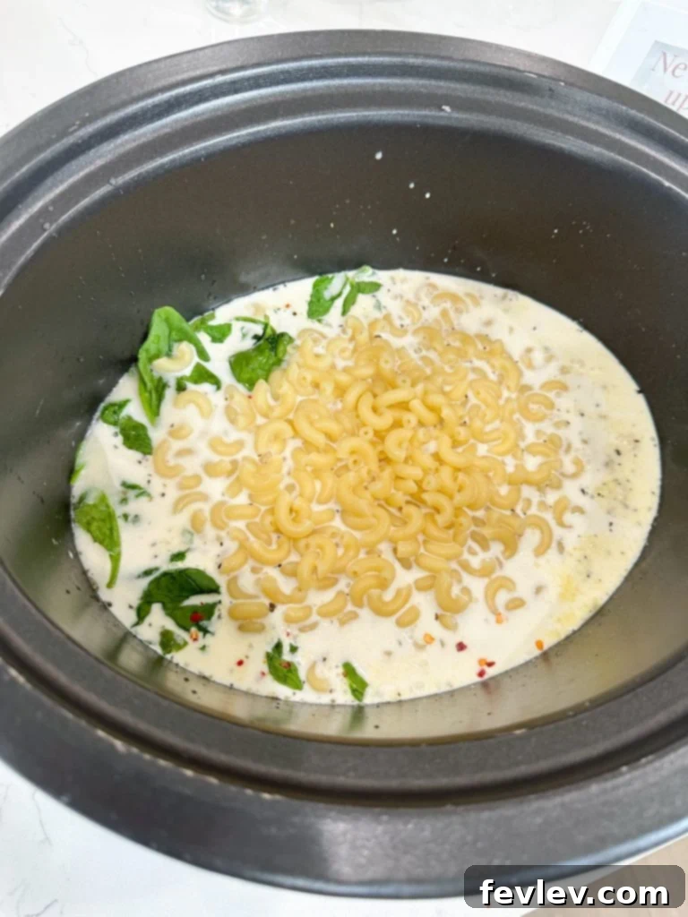 Comforting Slow Cooker Italian Chicken Noodle Soup 5 Mixing cornstarch and cold water to create a slurry for thickening slow cooker soup.