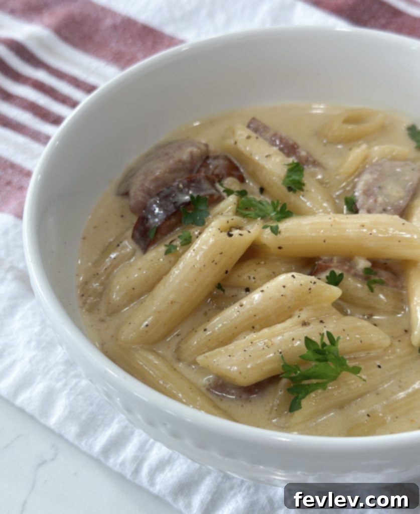 One Pot Cajun Chicken Alfredo leftovers in an airtight container for storage
