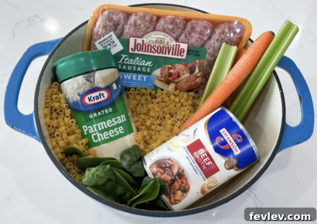 Close-up of fresh ingredients for One-Pot Italian Sausage Soup including sausage, vegetables, and herbs