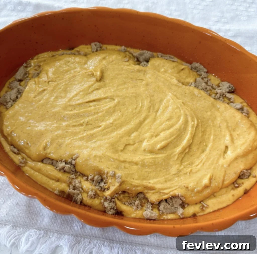 Layering brown sugar and the second half of pumpkin cake batter