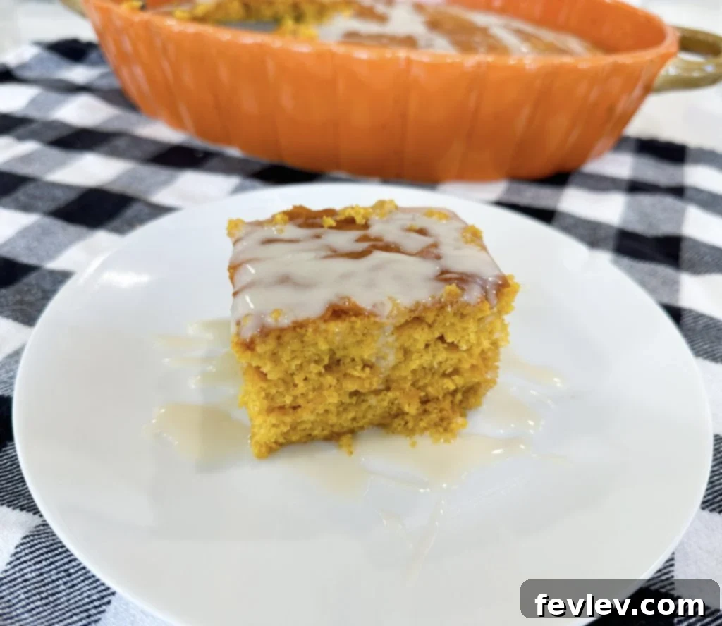 Sliced Pumpkin Honey Bun Cake with a fork, ready to be enjoyed
