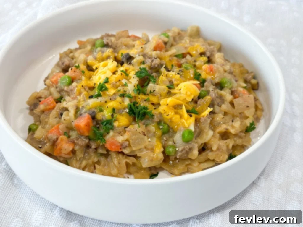 Finished Cheeseburger Hash Brown Casserole in a skillet, ready to serve