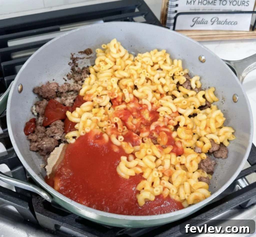 Sloppy Joe Mac n Cheese 3 Cooking ground turkey in a large skillet for sloppy joe