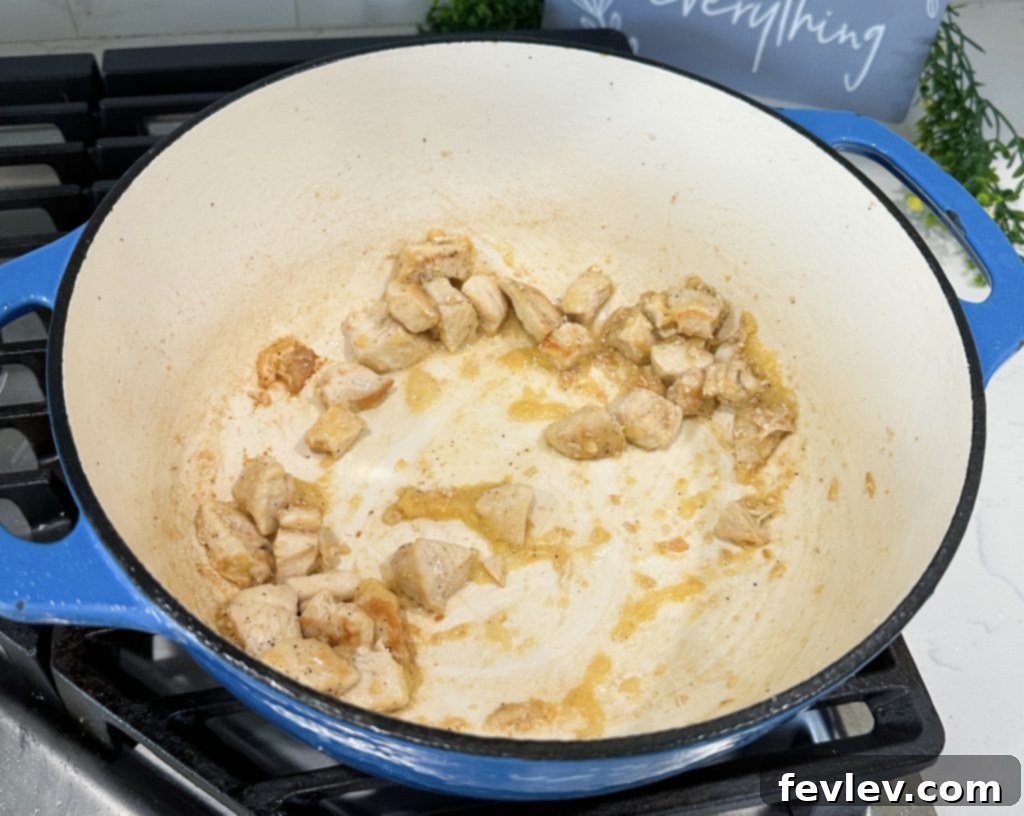 Effortless One-Pot Teriyaki Chicken and Rice 3 Searing cubed chicken breast in a large Dutch oven with oil, salt, and pepper.