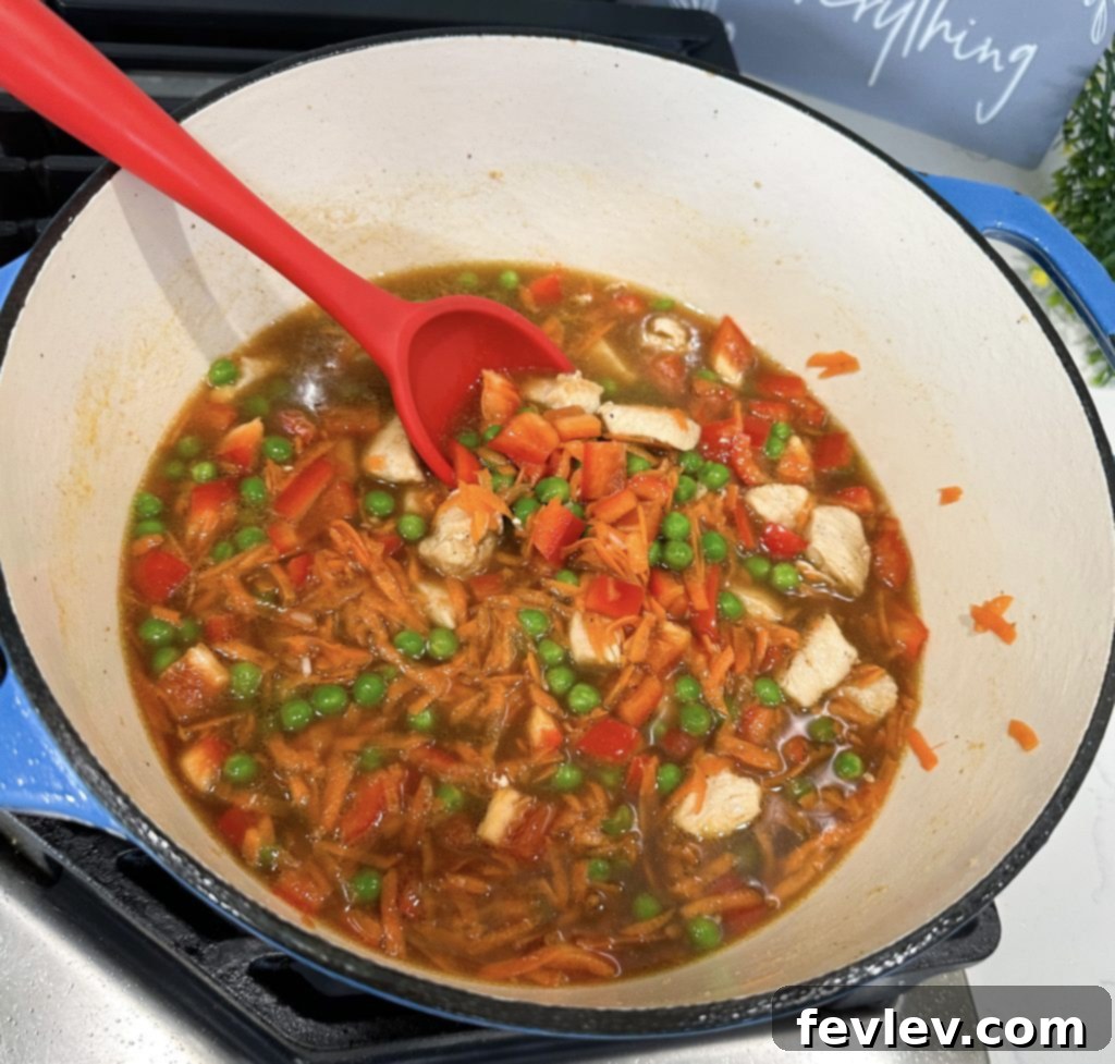 Effortless One-Pot Teriyaki Chicken and Rice 5 Finished one pot teriyaki chicken and rice, garnished and ready to serve.