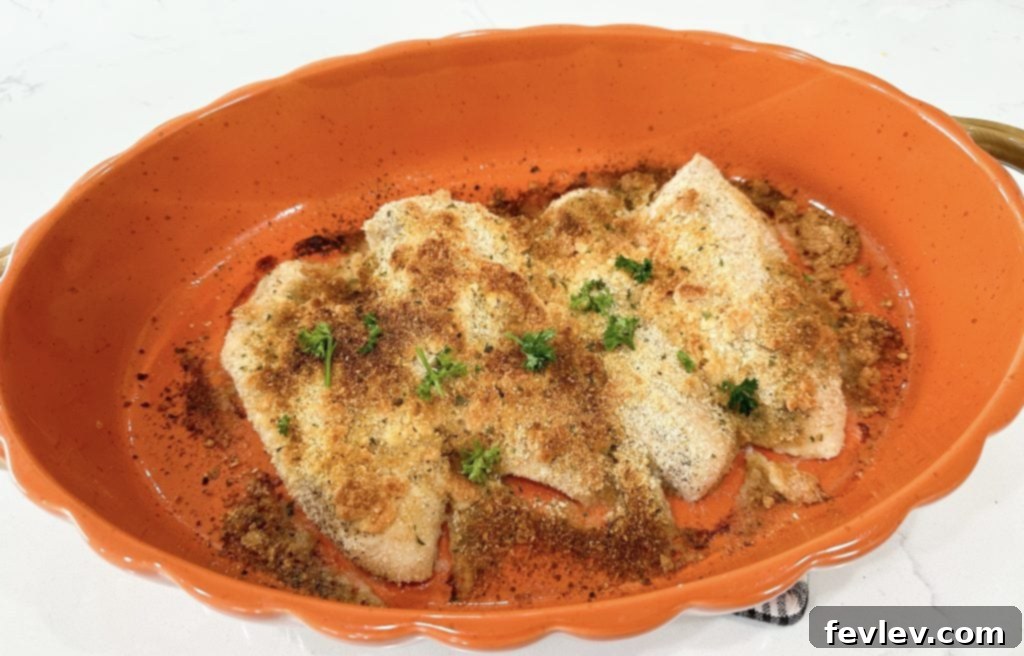 Crispy baked parmesan panko chicken pieces stored in an airtight container for freshness.
