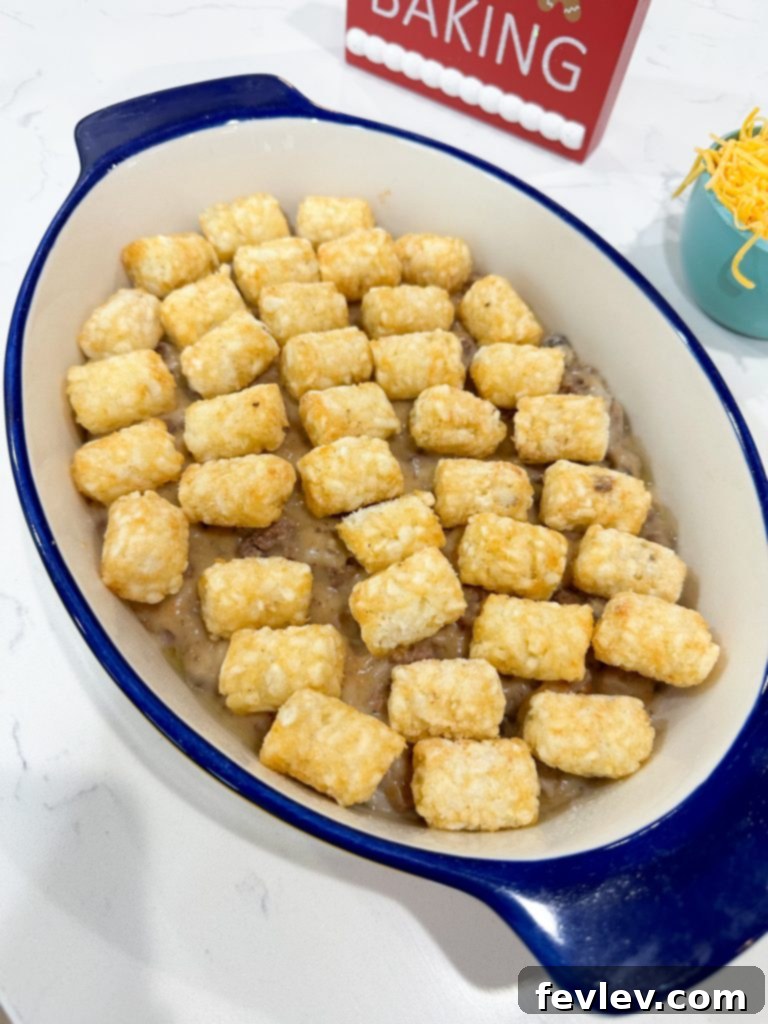 layering tater tots on top of casserole