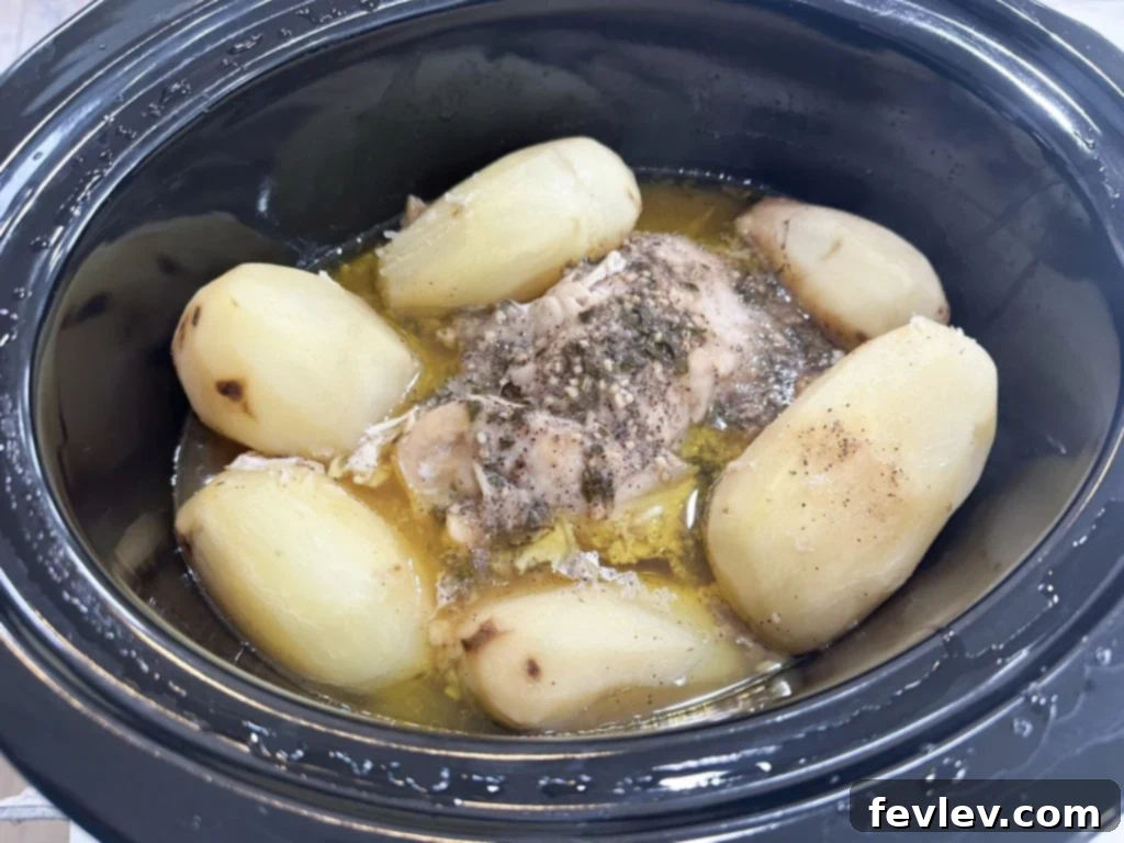 Ultimate Slow Cooker Turkey Dinner with Creamy Mash 5 Slow cooker turkey and potatoes cooking