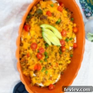 Hearty Breakfast Burrito Casserole baked with eggs, sausage, peppers, onions, and cheese, ready to serve as a perfect make-ahead breakfast.