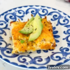 Delicious Classic Hashbrown Bacon Breakfast Casserole ready to serve, featuring crispy hashbrowns, golden eggs, savory bacon, and melted cheddar cheese