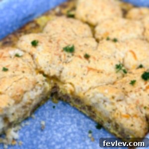 Golden brown Cheddar Bay Biscuit Breakfast Casserole with savory sausage and eggs, ready to be served for brunch.