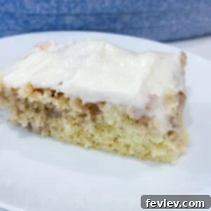 The best cinnamon roll poke cake, featuring a rich, swirled cinnamon glaze and tender cake, perfect for a special treat.