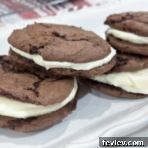 Delectable homemade Oreo cookie sandwiches with a rich, creamy filling, perfectly mimicking the classic beloved treat.