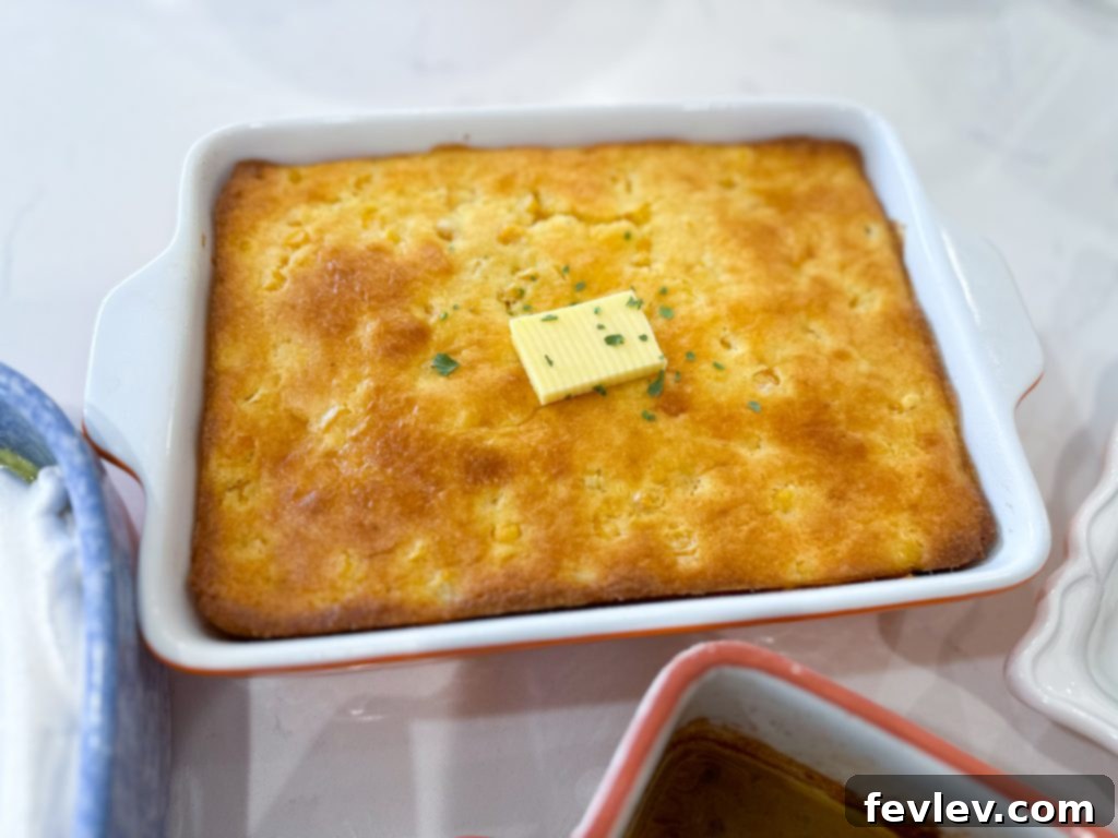 Your Festive Feast for Under Twenty Dollars 3 Golden brown cornbread casserole baked in a square dish.