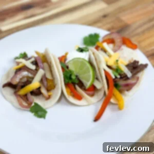 Easy Sheet Pan Steak Fajitas with vibrant peppers and onions