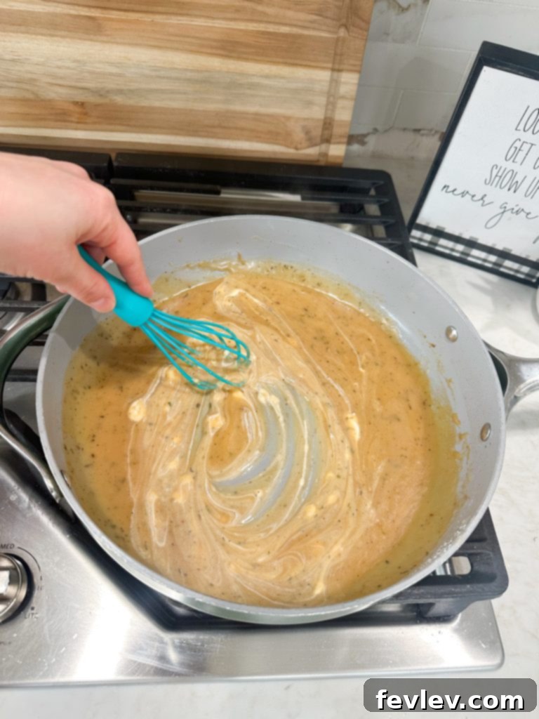 Effortless Pork Chops with Savory Gravy 6 Whisking flour into butter for a roux for Easy Pork Chops and Gravy