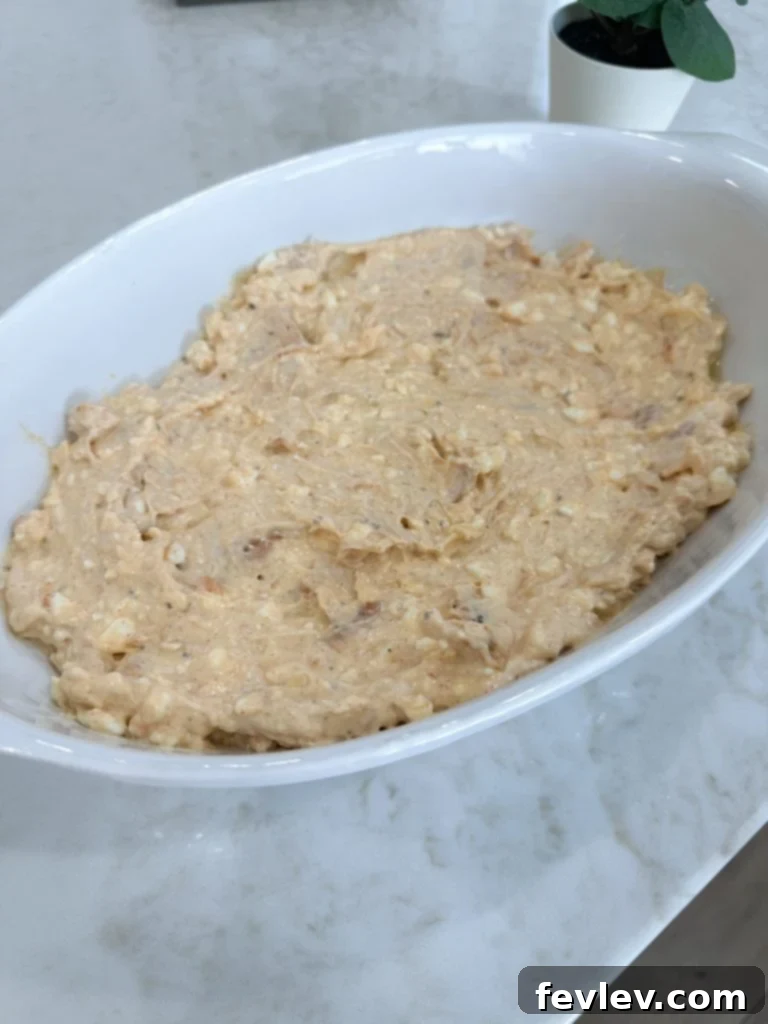 million dollar chicken casserole mixture spread evenly in baking dish