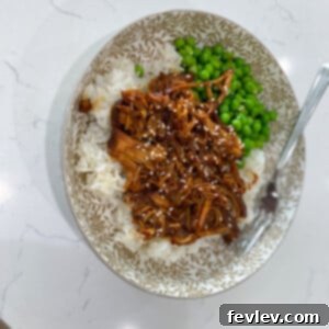Slow Cooker Honey Garlic Chicken, coated in a sticky, sweet, and savory glaze